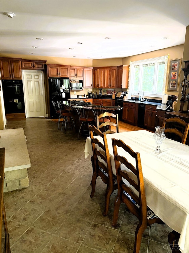 8030 Deershadow Ln, Montgomery, OH 45242 - dining area with recessed lighting and dark tile patterned flooring