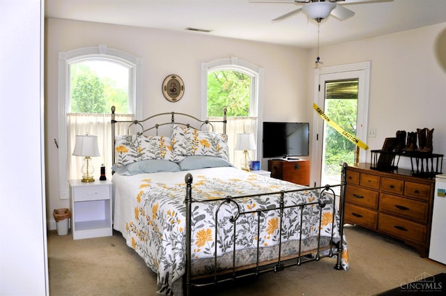 8030 Deershadow Ln, Montgomery, OH 45242 - carpeted bedroom featuring access to outside and ceiling fan