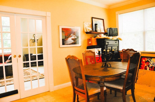 8030 Deershadow Ln, Montgomery, OH 45242 - carpeted dining space featuring healthy amount of natural light, crown molding, and french doors