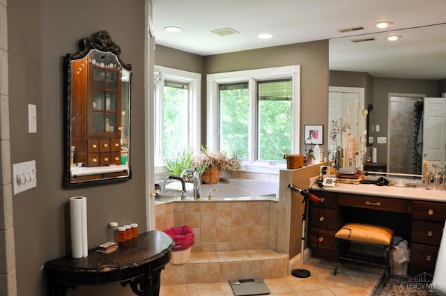 8030 Deershadow Ln, Montgomery, OH 45242 - full bath with healthy amount of natural light, a bath, vanity, tile patterned floors, and recessed lighting