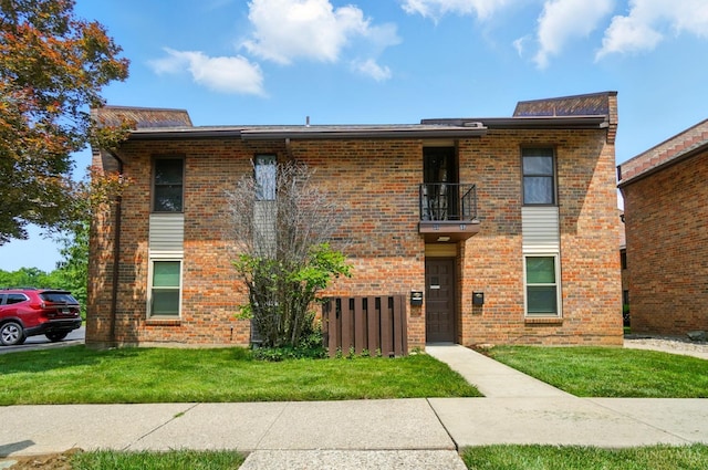 55 Stillmeadow Dr, Pierce Twp, OH 45245 - view of front of property featuring a balcony, brick siding, and a front yard
