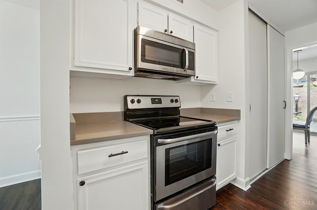 55 Stillmeadow Dr, Pierce Twp, OH 45245 - kitchen with stainless steel appliances, dark wood-type flooring, and white cabinets