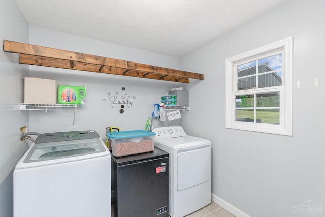 13726 New Harmony Shiloh Rd, Pike Twp, OH 45154 - laundry room featuring washer and dryer and light tile patterned floors
