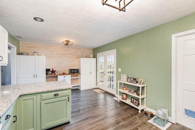 13726 New Harmony Shiloh Rd, Pike Twp, OH 45154 - kitchen with green cabinets, french doors, dark wood-style flooring, a textured ceiling, and light stone counters