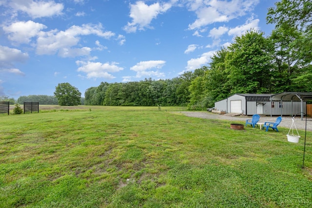 13726 New Harmony Shiloh Rd, Pike Twp, OH 45154 - view of green lawn featuring an outbuilding and a garage