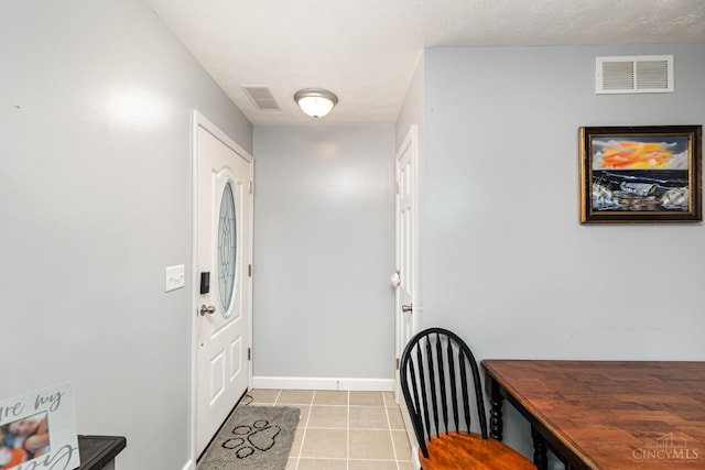 13726 New Harmony Shiloh Rd, Pike Twp, OH 45154 - foyer entrance featuring light tile patterned floors and baseboards