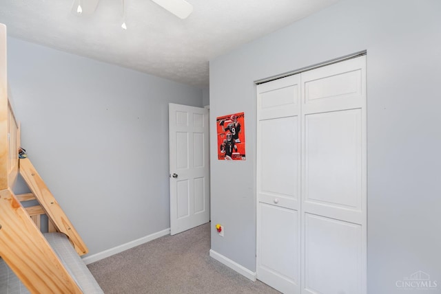 13726 New Harmony Shiloh Rd, Pike Twp, OH 45154 - unfurnished bedroom featuring carpet flooring, a closet, and a ceiling fan