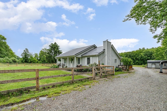 13726 New Harmony Shiloh Rd, Pike Twp, OH 45154 - view of front of house with a chimney, a fenced front yard, and a metal roof
