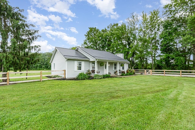 13726 New Harmony Shiloh Rd, Pike Twp, OH 45154 - view of front of property featuring a chimney, a fenced backyard, covered porch, and a metal roof
