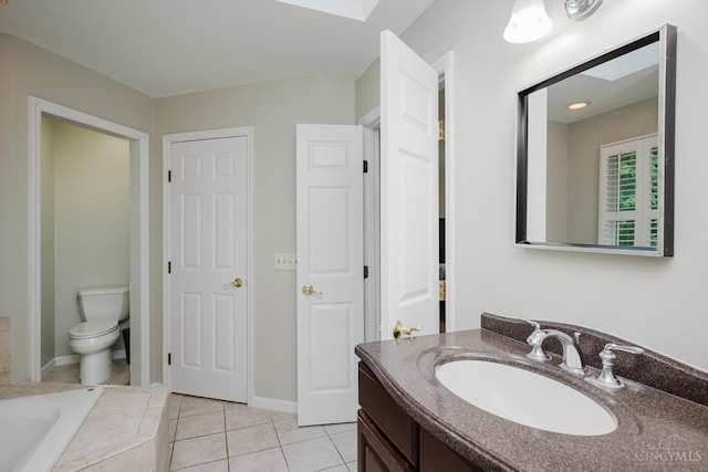 9930 Tall Oaks Ct, Deerfield Twp, OH 45140 - full bathroom featuring vanity, tile patterned flooring, tiled tub, and a skylight