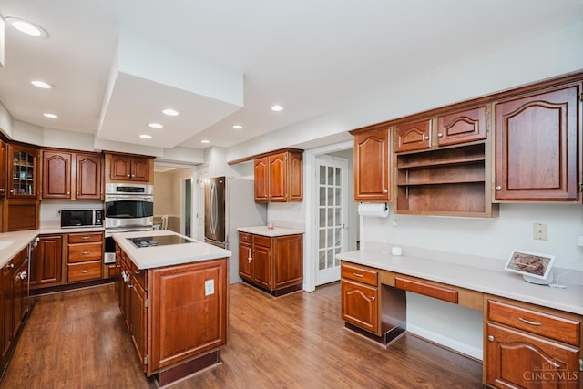 9930 Tall Oaks Ct, Deerfield Twp, OH 45140 - kitchen featuring built in study area, black electric cooktop, dark wood-type flooring, light countertops, and recessed lighting