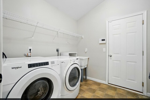 3492 Ballymore Ct, Pierce Twp, OH 45245 - washroom with washing machine and dryer and baseboards