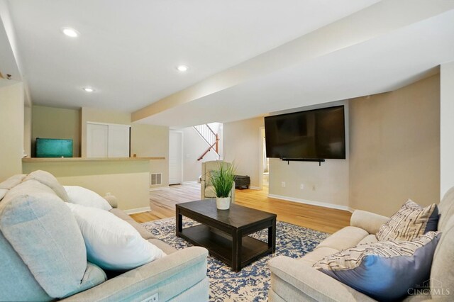 3492 Ballymore Ct, Pierce Twp, OH 45245 - living room with light wood-type flooring, stairs, and recessed lighting