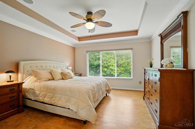 3492 Ballymore Ct, Pierce Twp, OH 45245 - bedroom featuring a tray ceiling, light wood finished floors, ornamental molding, and ceiling fan