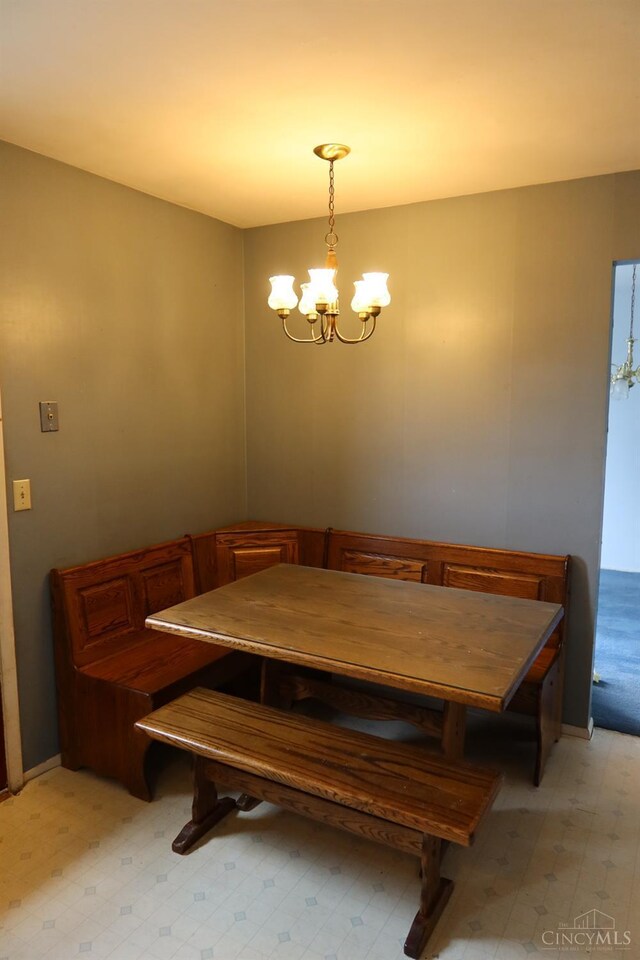 704 Trafalgar Ct, Middletown, OH 45044 - dining area with a chandelier and light floors