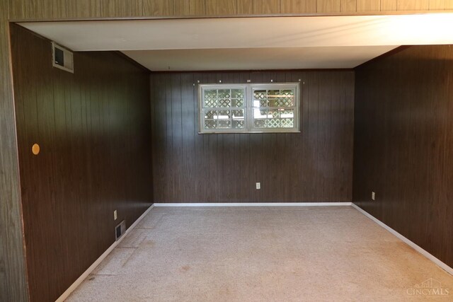 704 Trafalgar Ct, Middletown, OH 45044 - spare room with carpet flooring and wood walls