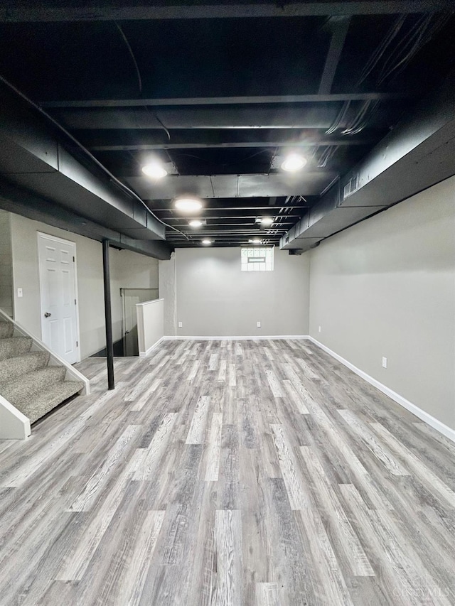 3501 Mcfarlan Rd, Cincinnati, OH 45211 - basement featuring wood finished floors and stairway