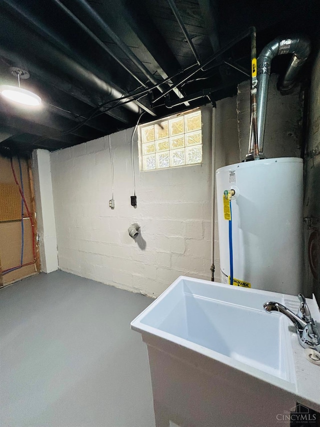 3501 Mcfarlan Rd, Cincinnati, OH 45211 - basement featuring gas water heater and a sink