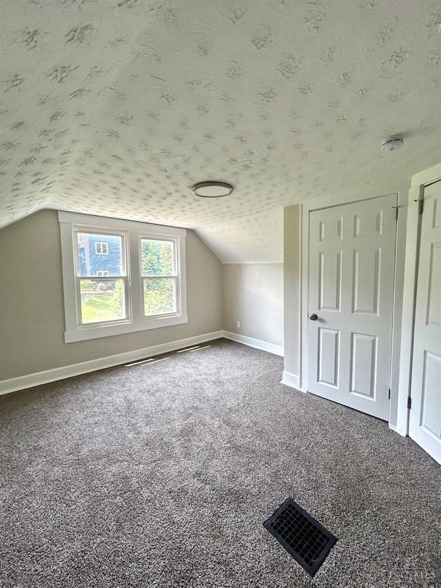 3501 Mcfarlan Rd, Cincinnati, OH 45211 - additional living space featuring a textured ceiling, carpet floors, and vaulted ceiling