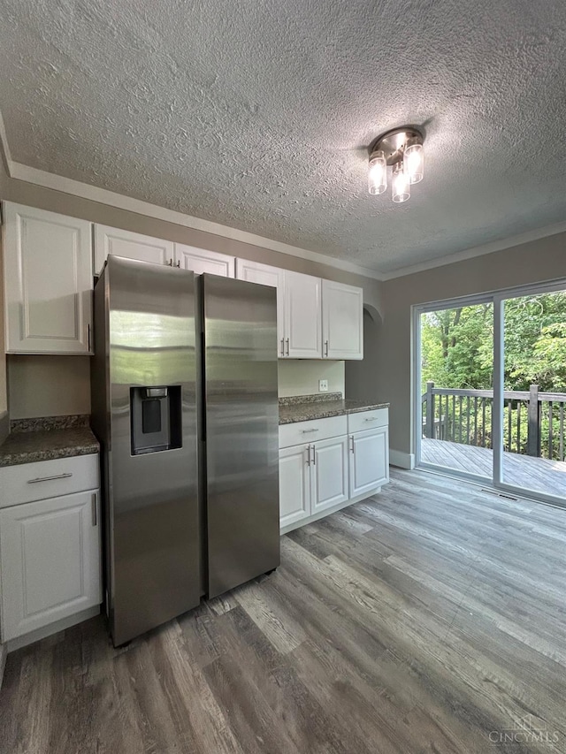 3501 Mcfarlan Rd, Cincinnati, OH 45211 - kitchen with stainless steel fridge with ice dispenser, a textured ceiling, wood finished floors, white cabinets, and crown molding