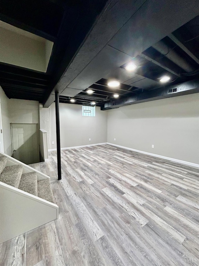 3501 Mcfarlan Rd, Cincinnati, OH 45211 - basement with wood finished floors and stairs