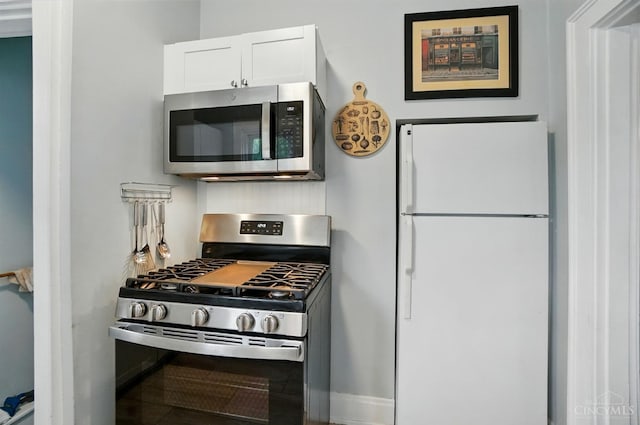 7002 Cambridge Ave, Columbia Twp, OH 45227 - kitchen featuring stainless steel appliances and white cabinetry