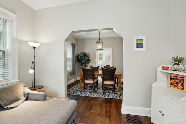 7002 Cambridge Ave, Columbia Twp, OH 45227 - living area with arched walkways and dark wood-style floors