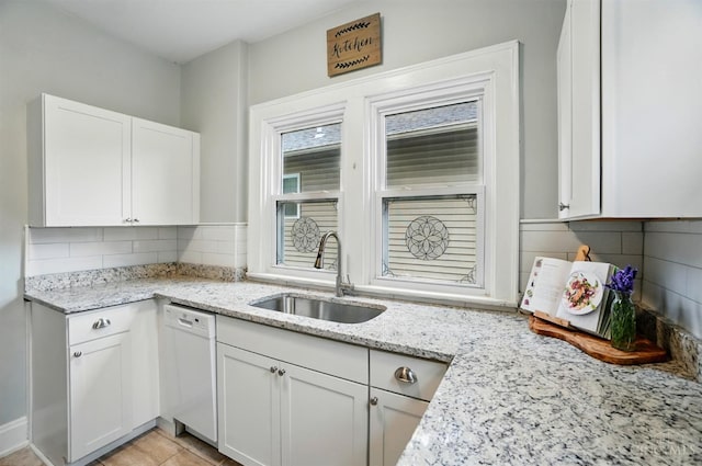 7002 Cambridge Ave, Columbia Twp, OH 45227 - kitchen with dishwasher, white cabinetry, tasteful backsplash, and light stone counters
