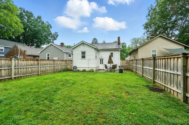 7002 Cambridge Ave, Columbia Twp, OH 45227 - rear view of property featuring a fenced backyard and a patio
