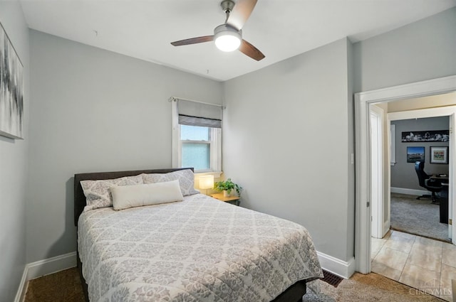7002 Cambridge Ave, Columbia Twp, OH 45227 - bedroom with an office area, a ceiling fan, and light carpet