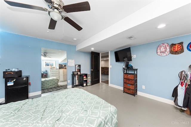 6226 Hunt Rd, Wayne Twp, OH 45118 - bedroom with concrete floors, freestanding refrigerator, recessed lighting, and a ceiling fan