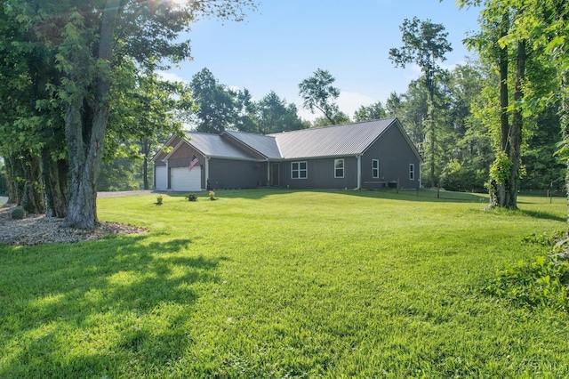 6226 Hunt Rd, Wayne Twp, OH 45118 - view of front of house featuring a front lawn, a metal roof, and a garage