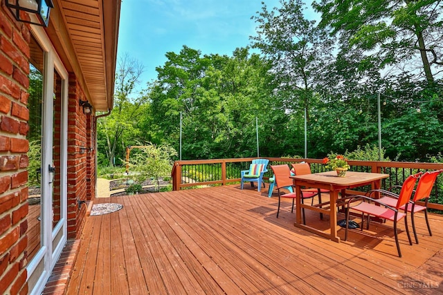 10730 Adventure Ln, Montgomery, OH 45242 - deck featuring outdoor dining area and view of wooded area
