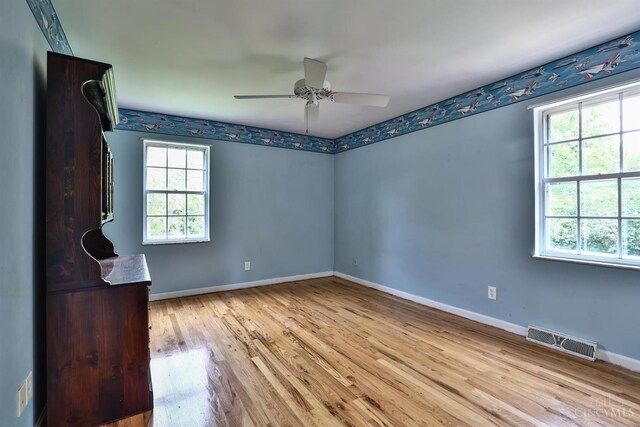 10730 Adventure Ln, Montgomery, OH 45242 - spare room with wood finished floors and a ceiling fan