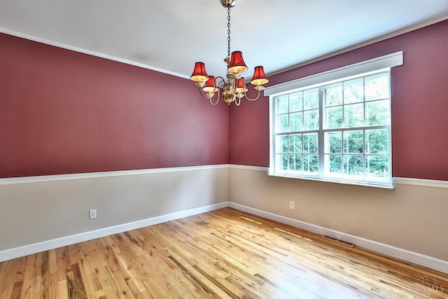 10730 Adventure Ln, Montgomery, OH 45242 - empty room with a chandelier and wood finished floors