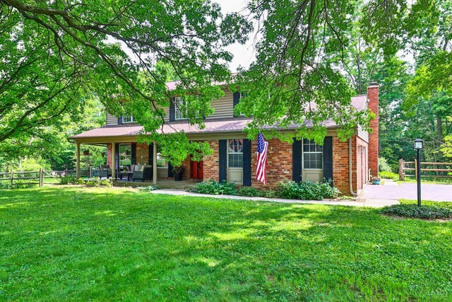 10730 Adventure Ln, Montgomery, OH 45242 - view of front of home featuring a chimney and brick siding