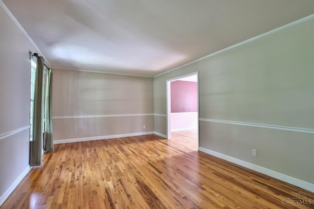 10730 Adventure Ln, Montgomery, OH 45242 - spare room with wood finished floors and crown molding