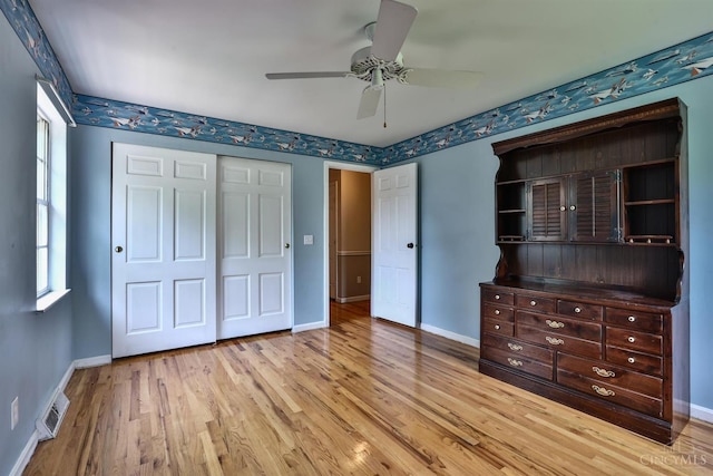 10730 Adventure Ln, Montgomery, OH 45242 - unfurnished bedroom featuring light wood-type flooring, ceiling fan, and a closet