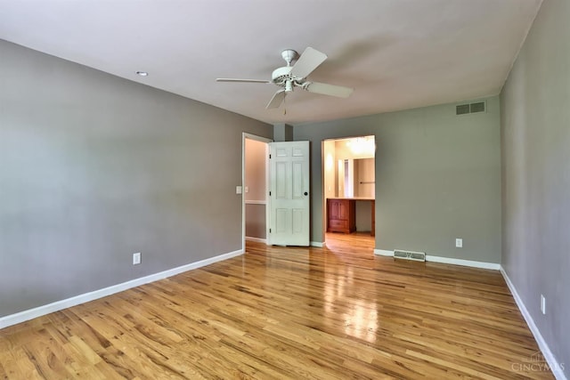 10730 Adventure Ln, Montgomery, OH 45242 - unfurnished bedroom featuring light wood-type flooring, ensuite bath, and a ceiling fan