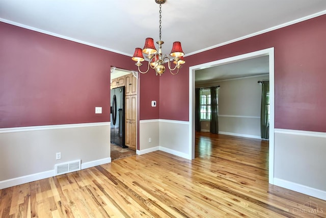 10730 Adventure Ln, Montgomery, OH 45242 - unfurnished dining area with a chandelier, light wood-style floors, and ornamental molding