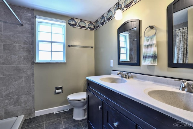 10730 Adventure Ln, Montgomery, OH 45242 - full bath featuring double vanity, tiled shower, and tile patterned flooring