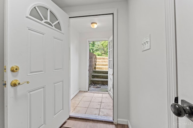 3494 Poole Rd, Colerain Twp, OH 45251 - doorway to outside featuring baseboards and stairway