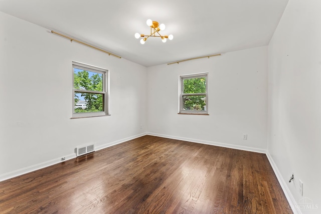 3494 Poole Rd, Colerain Twp, OH 45251 - unfurnished room with a chandelier and hardwood / wood-style flooring