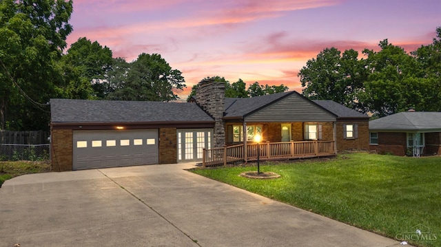 3494 Poole Rd, Colerain Twp, OH 45251 - single story home with french doors, concrete driveway, a garage, a chimney, and brick siding