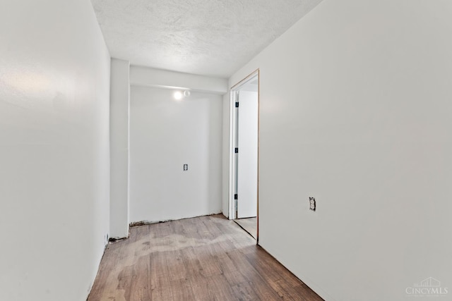 3494 Poole Rd, Colerain Twp, OH 45251 - hall with wood finished floors and a textured ceiling
