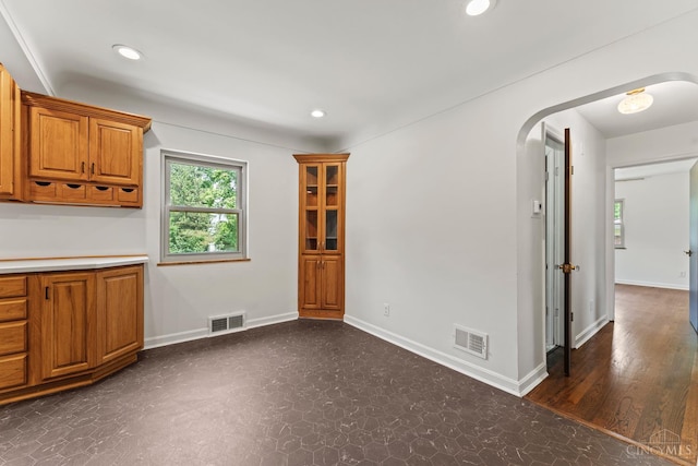 3494 Poole Rd, Colerain Twp, OH 45251 - unfurnished dining area with arched walkways, recessed lighting, and dark flooring