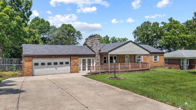 3494 Poole Rd, Colerain Twp, OH 45251 - ranch-style home with french doors, driveway, an attached garage, brick siding, and covered porch