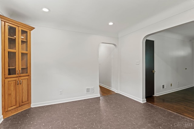 3494 Poole Rd, Colerain Twp, OH 45251 - empty room with arched walkways, tile patterned floors, and recessed lighting