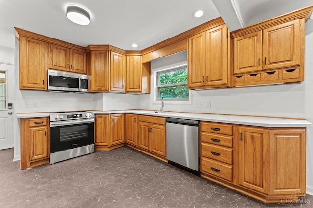 3494 Poole Rd, Colerain Twp, OH 45251 - kitchen featuring appliances with stainless steel finishes, light countertops, recessed lighting, and brown cabinets
