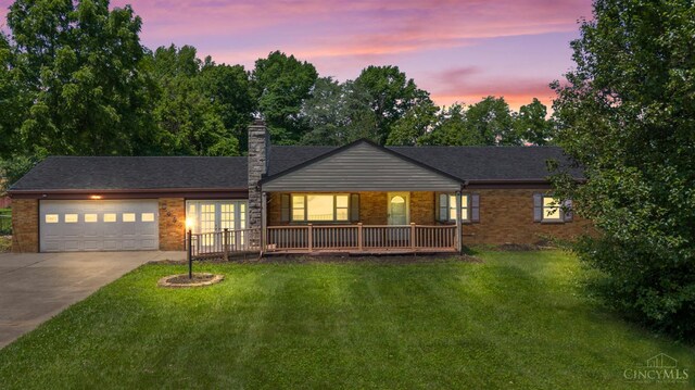 3494 Poole Rd, Colerain Twp, OH 45251 - ranch-style home featuring brick siding, driveway, a garage, and a front yard
